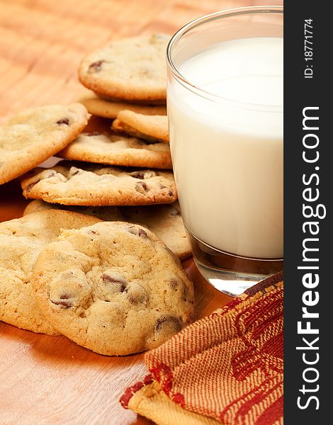 Chocolate chip cookied and a glass of milk. Chocolate chip cookied and a glass of milk
