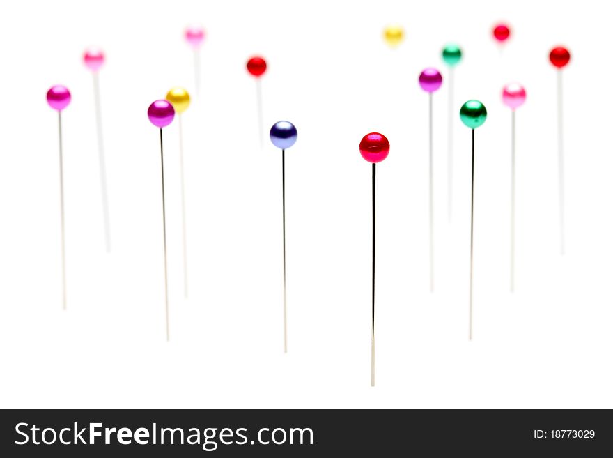 Colorful pins isolated on white background