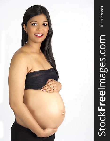 Sexy beautiful pregnant semi nude Indian woman in