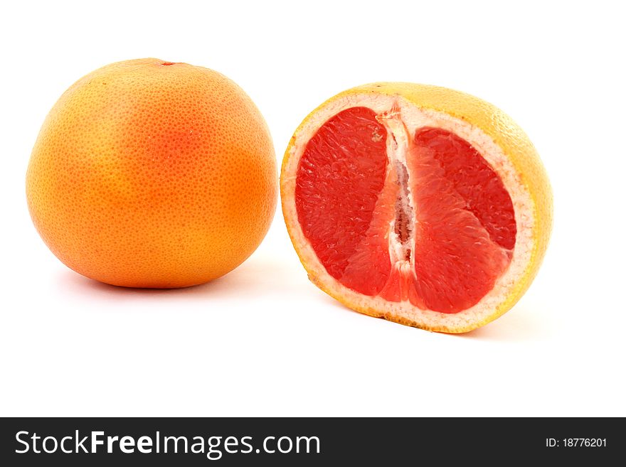 Fresh red grapefruit isolated over white background