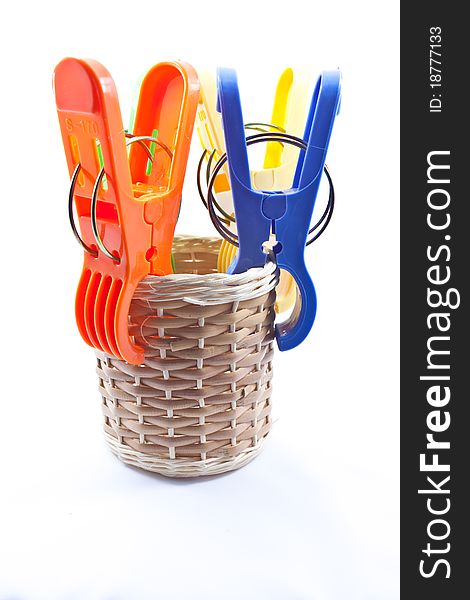 Colorful clothes pegs on white background