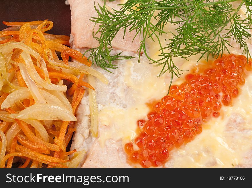 Broiled salmon steak with cream souse and red caviar decorated with dill, lemon and fried onion with carrot, isolated on white. Broiled salmon steak with cream souse and red caviar decorated with dill, lemon and fried onion with carrot, isolated on white