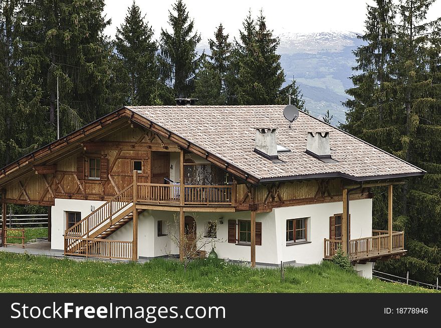 Traditional wooden House with Forest in Tyrol, Austria