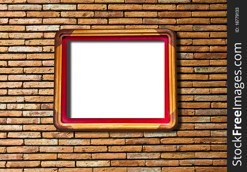 The Blank of wooden frame on brick wall texture background
