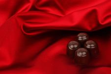 Chocolate Candy On Red Satin Royalty Free Stock Photo