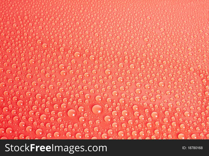 Red Water Drops Background on glass