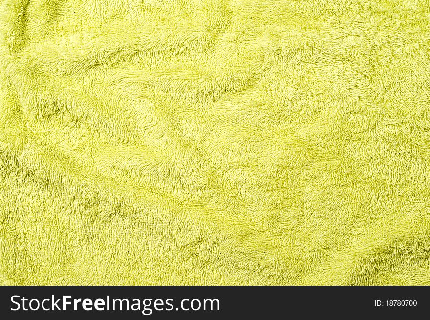 Green terry bath towel or bathrobe background