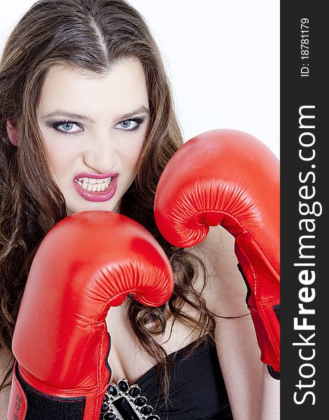 Portrait of young woman with boxing gloves