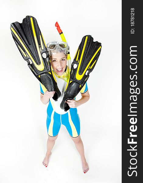 Standing young woman wearing neoprene with snorkeling equipment