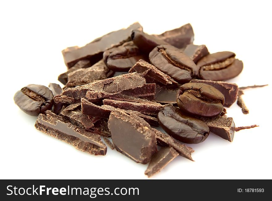 Grains of coffee and chocolate on a white background