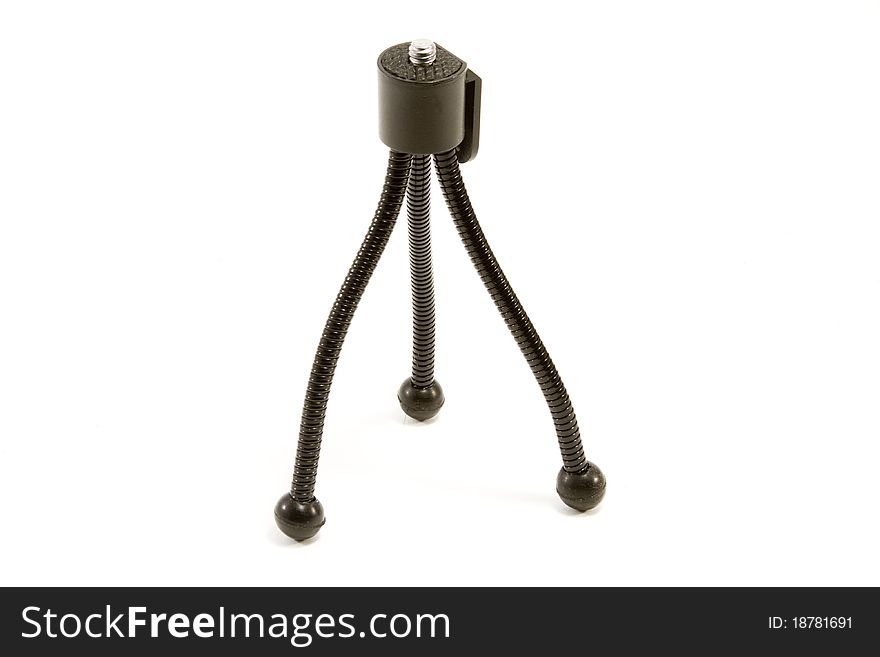 Tiny tripod on the white background