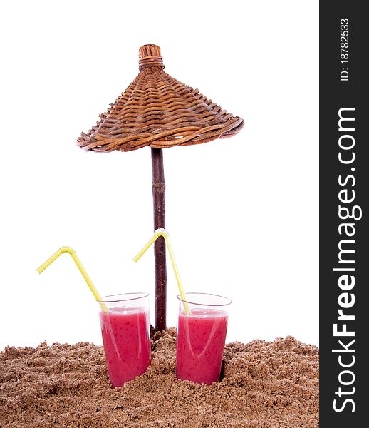 Two fresh summer fruit cocktails under a beach parasol isolated over white. Two fresh summer fruit cocktails under a beach parasol isolated over white