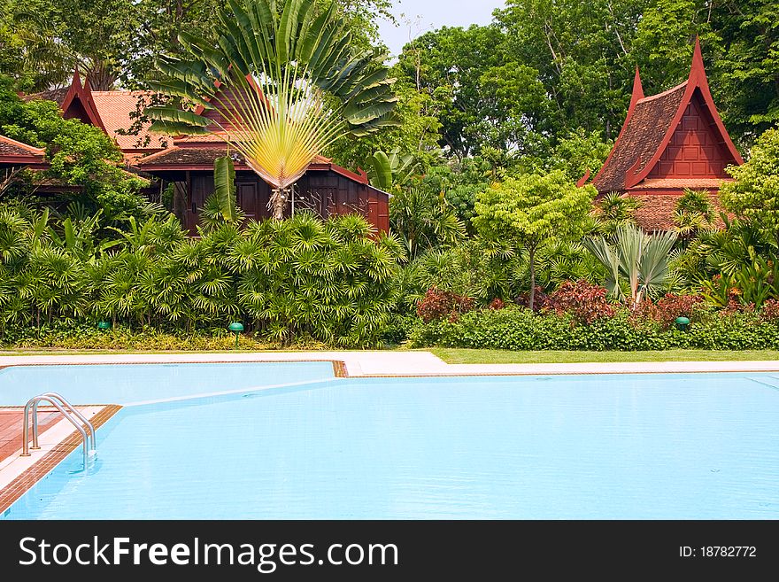 Swimming pool in tropical garden, Thailand