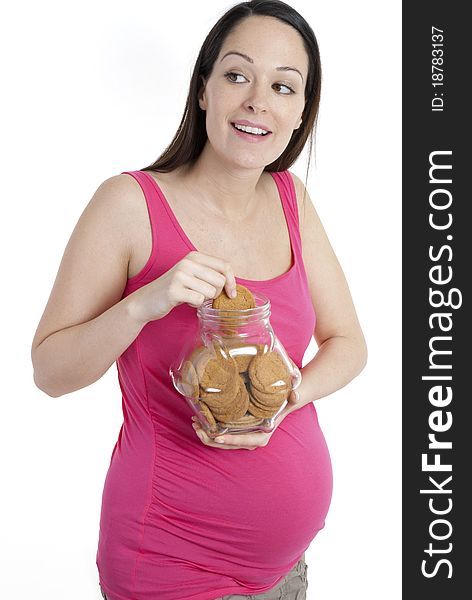 Pregnant woman sneaking in a biscuit. Pregnant woman sneaking in a biscuit