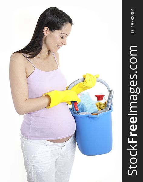 Happy pregnant woman holding cleaning products - nesting. Happy pregnant woman holding cleaning products - nesting