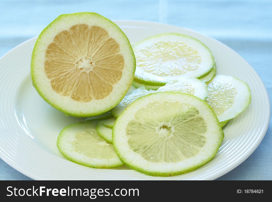 Closeup Of Lime Lemons On A Plate