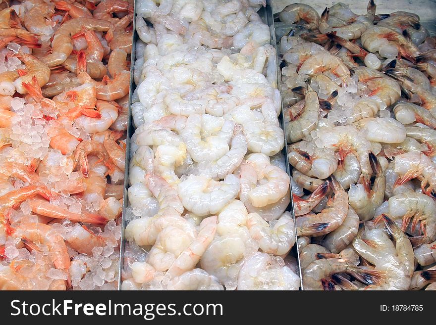 A selection of shrimp at a fish market. A selection of shrimp at a fish market