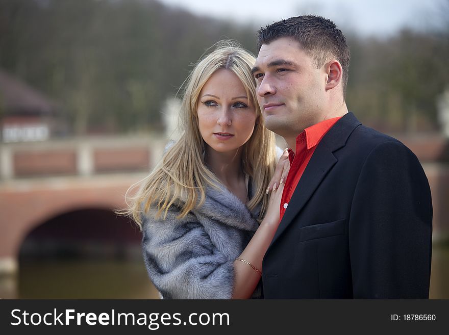 Portrait of happy young couple posing outdoor. Portrait of happy young couple posing outdoor