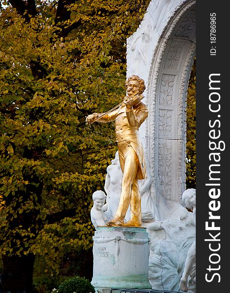 Famous golden Johann Strauss figure in Vienna Stadtpark