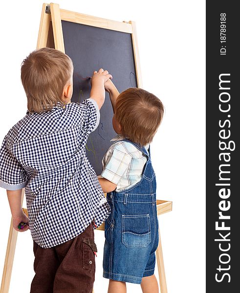 Boys are drawing on a blackboard. Isolated on a white background