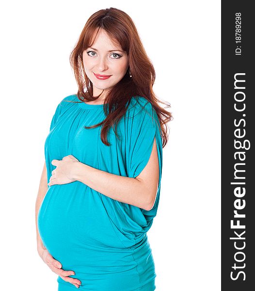 A pregnant smiling young woman. Isolated on a white background