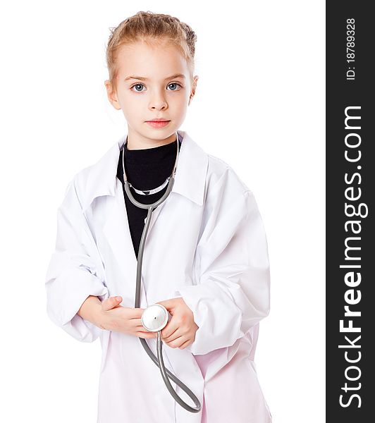 A girl is dressed as doctor. Isolated on a white background