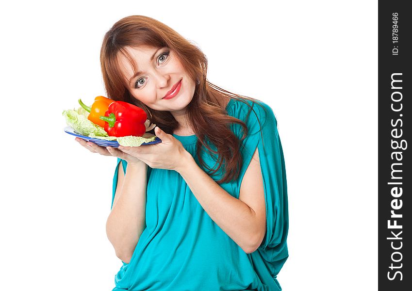 A pregnant woman with a plate of vegetables. isolated on a white background