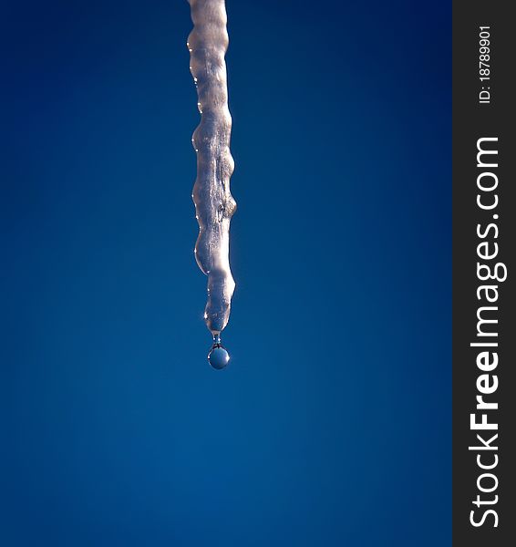 Icicle and drop on Blue. Icicle and drop on Blue