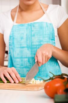 Woman Cutting Vegetables In Modern Kitchen Royalty Free Stock Photo
