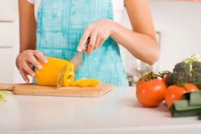 Woman Cutting Vegetables In A Kitchen Royalty Free Stock Photography Woman Cutting Vegetables In A Kitchen Royalty Free Stock Photography