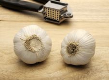 Garlic Press And Two Cloves Of Garlic Royalty Free Stock Photos Garlic Press And Two Cloves Of Garlic Royalty Free Stock Photos