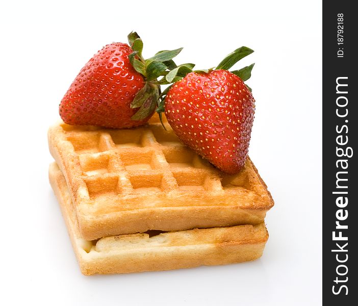 Waffles and strawberry isolated on white. Waffles and strawberry isolated on white