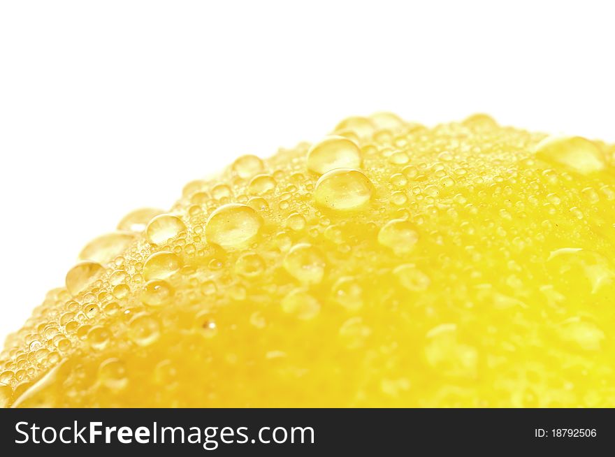 Yellow Lemon and dew closeup, isolated on a white background. Yellow Lemon and dew closeup, isolated on a white background.