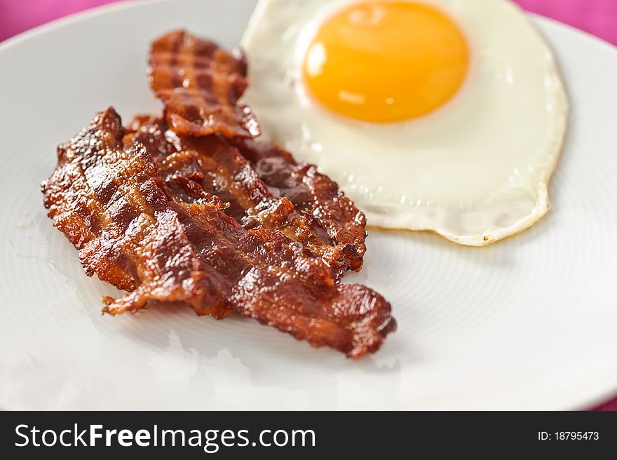 Closeup on bacon and egg