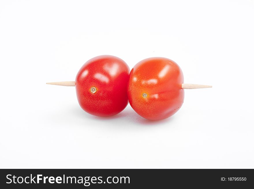 Cherry tomatoes with the toothpick. Cherry tomatoes with the toothpick