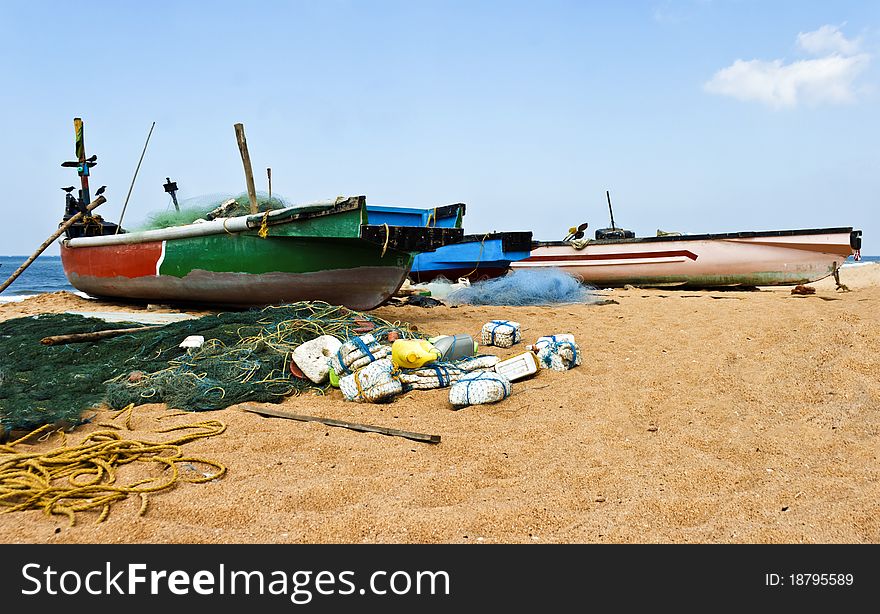 Fishing boats, nets, floats and tackle, blue skies, wispy clouds. Fishing boats, nets, floats and tackle, blue skies, wispy clouds