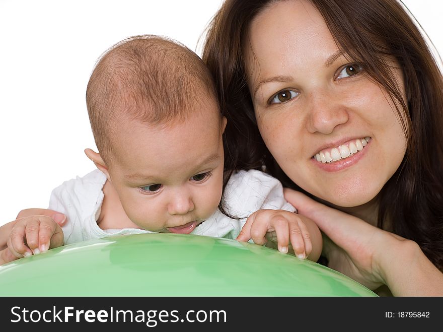 Newborn with her mother sitting at the table