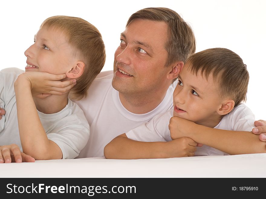 Father with his two sons on a white