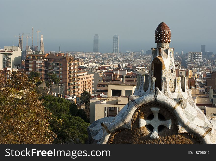 Park Guell, Montana Pelada, Barcelona, Spain - close-up view with the city in the background. Park Guell, Montana Pelada, Barcelona, Spain - close-up view with the city in the background