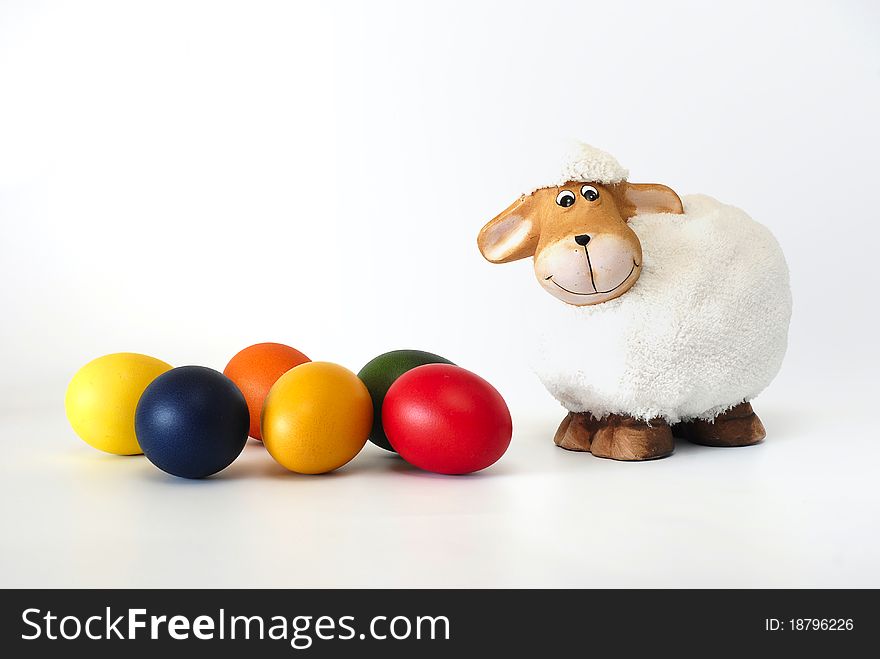 Easter painted eggs with the lamb on the white background. Easter painted eggs with the lamb on the white background