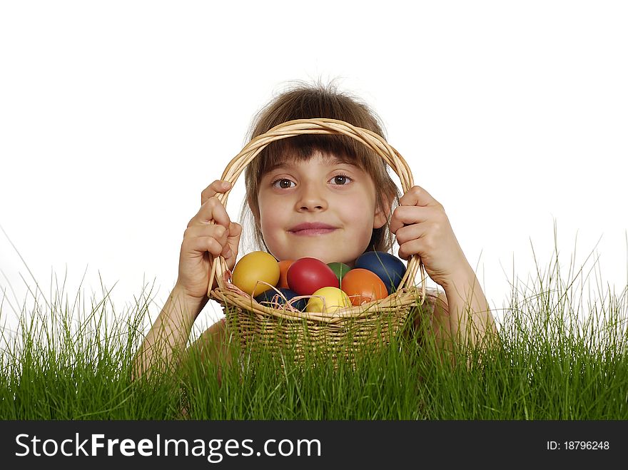 Girl keeping the basket with Easter painted eggs. Girl keeping the basket with Easter painted eggs