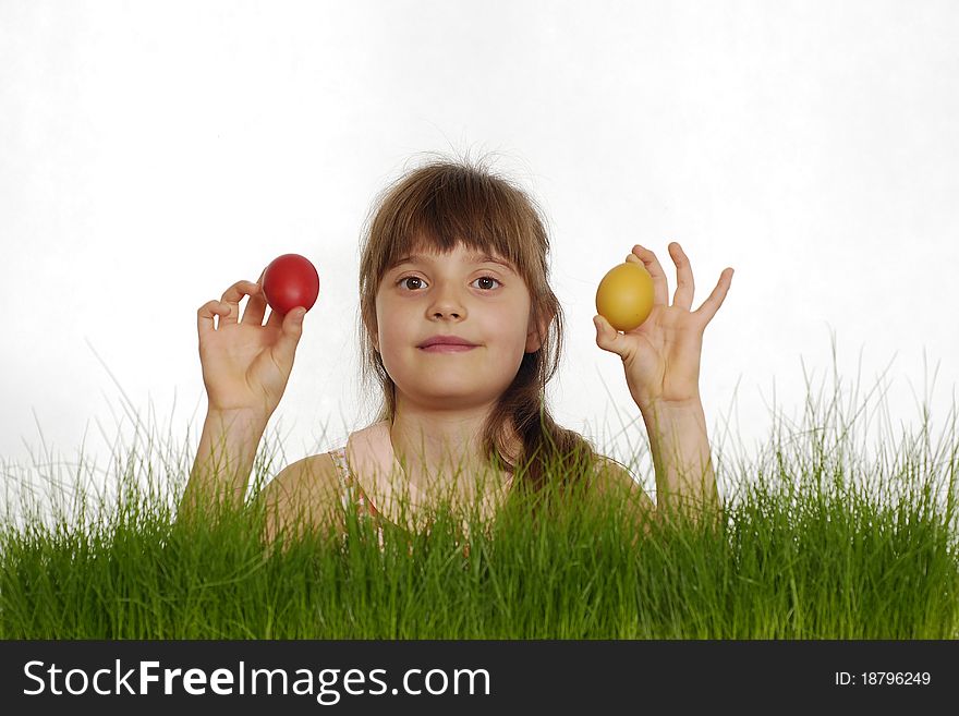 Girl with Easter painted eggs on the grass. Girl with Easter painted eggs on the grass