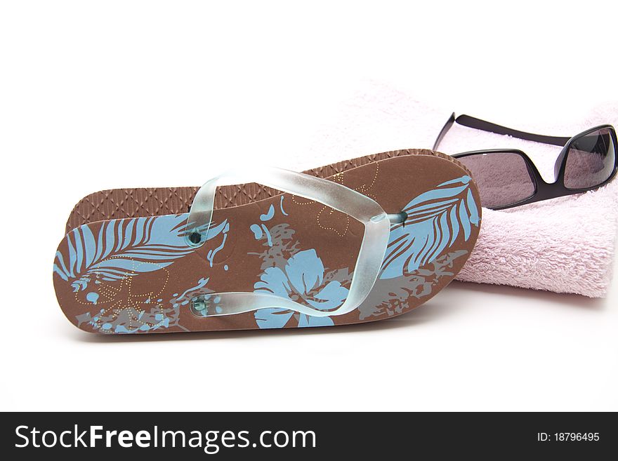 Flip Flop shoe on towel with sunglasses