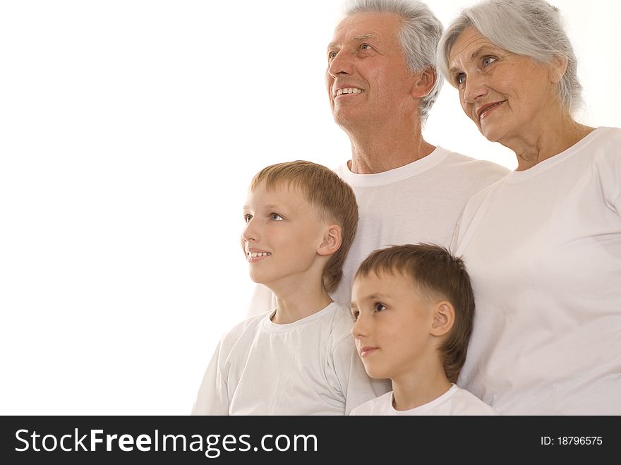 Family of four together on a white background
