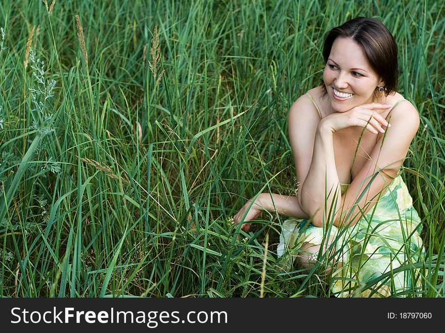 Beautiful happy girl at the summer residence