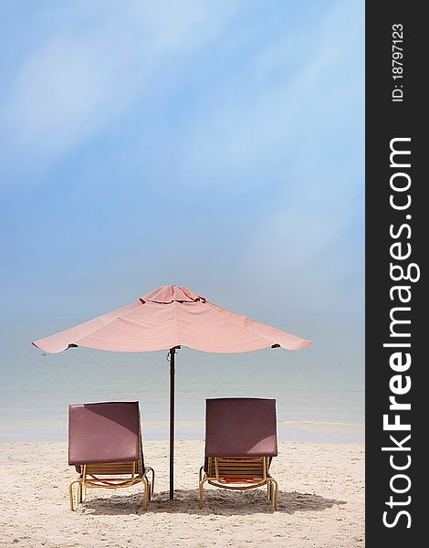 Chairs and umbrella on tropical beach. Chairs and umbrella on tropical beach