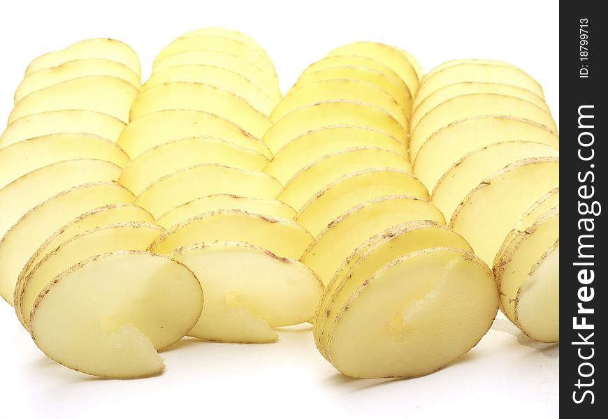 Raw potatoes cut in a spiral shot on a white background