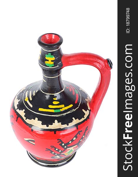 Painted terracotta jug isolated on white. Ornament is traditional from south Serbia and not under copyright laws.
