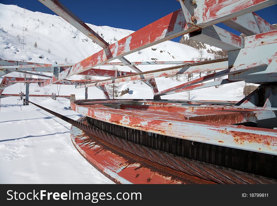 An abandoned chair lift under snow