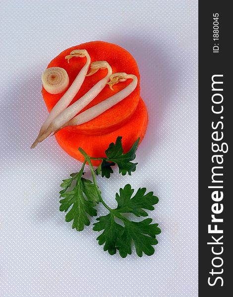 Carrot, sprouted-soya, lemongrass and parsley in pieces on the white background